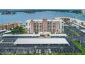 An aerial view of the property with assigned covered parking and a beautiful waterfront view at 7700 Sun Island S Dr # 404, South Pasadena, FL 33707