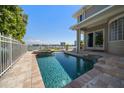 Sparkling pool and spa overlooking the waterfront, providing a serene outdoor oasis with ample space to relax at 785 Bay Esplanade, Clearwater Beach, FL 33767