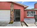 Close-up of a charming home featuring stone accents and a cozy front porch area at 11467 93Rd St, Largo, FL 33773