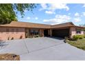 Spacious driveway leading to a single story residence with a two-car garage, and well-maintained landscaping at 12808 Candlewood Way, Hudson, FL 34667