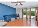 Inviting living room features hardwood floors, natural light, and access to a backyard at 14053 Notreville Way, Tampa, FL 33624