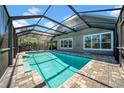 A screened-in pool area provides a private oasis for relaxation and recreation at 15861 Starling Water Dr, Lithia, FL 33547