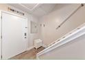Entryway features tile floors, a coat rack, a mirror, and access to the stairs at 19823 Gulf Blvd # 42, Indian Shores, FL 33785