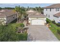 An aerial view of this home showcases its well-maintained landscaping and serene neighborhood setting at 2632 Tarragona Way, Wesley Chapel, FL 33543