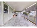 Covered carport featuring patterned concrete, offering sheltered parking and outdoor space at 37539 Landis Ave, Zephyrhills, FL 33541