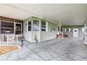 Spacious carport with patterned concrete and ample room for parking at 37539 Landis Ave, Zephyrhills, FL 33541