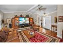 Spacious living room features a large entertainment center and comfortable seating at 7944 Royal Hart Dr, New Port Richey, FL 34653