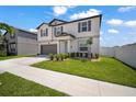 Charming two-story home with well-maintained lawn and landscape at 13227 Great Plains Dr, Riverview, FL 33579