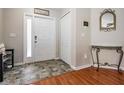 Inviting entryway featuring tiled floors, a front door with sidelight, closet, and decorative details at 13511 Fladgate Mark Dr, Riverview, FL 33579