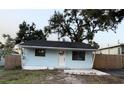 Charming home featuring a quaint entryway, simple design, and inviting facade at 1408 San Juan Ct, Clearwater, FL 33756