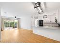 Bright open-concept living space featuring bamboo floors and a slider to the private patio at 2314 S Clewis Ct # 106, Tampa, FL 33629
