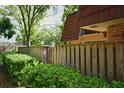 View of the side yard and fence, offering privacy and a touch of nature at 2725 14Th Ct, Palm Harbor, FL 34684