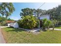 Lush greenery surrounds this stylish home's front entrance and walkway at 3131 W Fielder St, Tampa, FL 33611
