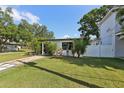 Beautiful home with green grass and lush landscaping at 3131 W Fielder St, Tampa, FL 33611