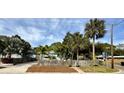 Inviting home with a fenced yard, lush palm trees, and a well-maintained front garden at 4501 26Th S Ave, St Petersburg, FL 33711