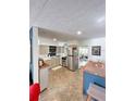 Well-lit kitchen with stainless steel appliances, light countertops, and ample cabinet space at 4501 26Th S Ave, St Petersburg, FL 33711