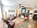 Cozy living room featuring unique flooring, a ceiling fan, and comfortable seating at 4501 26Th S Ave, St Petersburg, FL 33711