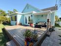 Inviting backyard deck area perfect for outdoor dining and entertaining at 5201 18Th S Ave, Gulfport, FL 33707