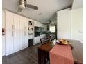 Bright kitchen featuring white cabinetry, stainless steel appliances, and modern fixtures at 5201 18Th S Ave, Gulfport, FL 33707