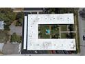 Aerial view of the building with a large courtyard, lush greenery, and convenient parking at 525 9Th N Ave # 2, St Petersburg, FL 33701
