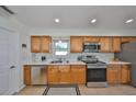 Charming kitchen with stainless steel appliances, tile flooring, and bright marble countertops at 7491 Cedar Ne St, St Petersburg, FL 33702