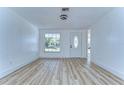 Open floor plan with wood flooring and new front door at 911 Kirkcaldy Way, Valrico, FL 33594