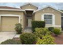 A close up of the front door and landscaping of the single-Gathering home at 11318 Laurel Brook Ct, Riverview, FL 33569