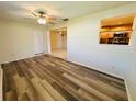 Inviting space showcasing updated floors and seamlessly connecting to the adjacent dining area at 12054 145Th St, Largo, FL 33774