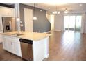 Gourmet kitchen featuring an island with stainless steel appliances and granite countertops at 17833 Althea Blue Pl, Lutz, FL 33558