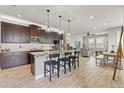 Modern kitchen with granite countertops, stainless steel appliances, and an open layout at 18872 Noble Caspian Dr, Lutz, FL 33558