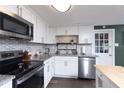This updated kitchen showcases stainless steel appliances, granite countertops, and a modern backsplash at 1920 30Th E Ave, Bradenton, FL 34208