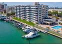 Stunning waterfront condo building with boat docks and pool; your tropical paradise awaits at 223 Island Way # 5E, Clearwater Beach, FL 33767