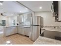 Spacious kitchen boasting stainless appliances and stone countertops at 3103 E Emma St, Tampa, FL 33610