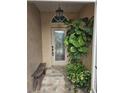 Entryway with paver flooring, a bench, and a leafy green plant at 607 Manchester Woods Dr # 84, Sun City Center, FL 33573