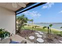 Inviting outdoor patio featuring landscaping and views of the water at 7700 Sun Island S Dr # 107, South Pasadena, FL 33707