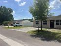 Cozy single-Gathering home showcasing a driveway, well-maintained landscaping, and a peaceful neighborhood setting at 8804 Briar Hollow Ct, Tampa, FL 33634