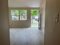 Bright living room with modern floors and fresh, neutral walls, capturing a welcoming atmosphere at 8804 Briar Hollow Ct, Tampa, FL 33634