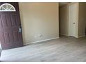 Open-concept living area with modern floors, neutral walls, and ample natural light at 8804 Briar Hollow Ct, Tampa, FL 33634