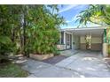 Exterior view of the home featuring a covered carport and well-maintained landscaping at 921 24Th N Ave, St Petersburg, FL 33704