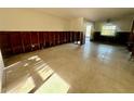 Living room area showing the studs, tile floor and a bright window at 200 Country Club Dr # 1101, Largo, FL 33771
