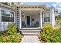 Inviting front porch with neutral colors and a cozy seating area at 2815 W Estrella St, Tampa, FL 33629