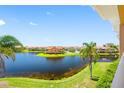 Beautiful water view from a condo balcony, featuring lush greenery and serene surroundings at 6 Academy S Way # 23A, St Petersburg, FL 33711
