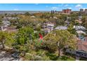 Aerial view of a home with mature trees and in proximity to the ocean at 646 16Th Ne Ave, St Petersburg, FL 33704