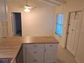 Bright kitchen featuring modern cabinets and a functional breakfast bar, seamlessly connected to the dining area at 754 71St N Ave, St Petersburg, FL 33702