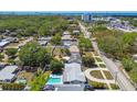 Aerial view of neighborhood showcasing community and proximity to urban areas at 827 Virginia St, Dunedin, FL 34698