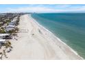 Expansive beachfront with clear blue water, showcasing the property's proximity to the beautiful coastline at 864 Mandalay Ave, Clearwater Beach, FL 33767