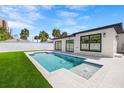 Stylish outdoor pool with modern patio and lush lawn, ideal for relaxing and entertaining in style at 864 Mandalay Ave, Clearwater Beach, FL 33767