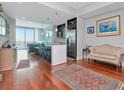 Open-concept living space features hardwood floors, kitchen with island, and water views at 912 Channelside Dr # 2501, Tampa, FL 33602