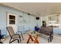 Enclosed patio with comfortable seating, perfect for relaxing outdoors at 11487 80Th Ave, Seminole, FL 33772