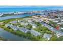 Beautiful aerial view of waterfront condos with lush landscaping, and Gulf of Mexico in the background at 14649 Seminole Trl # 5, Seminole, FL 33776